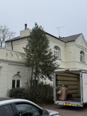 305 White Glove Surrey removals van outside a large home