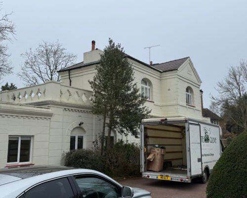 305 White Glove Surrey removals van outside a large home