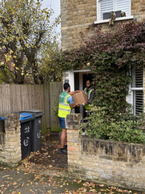 307 White Glove Surrey movers carrying a box into a home