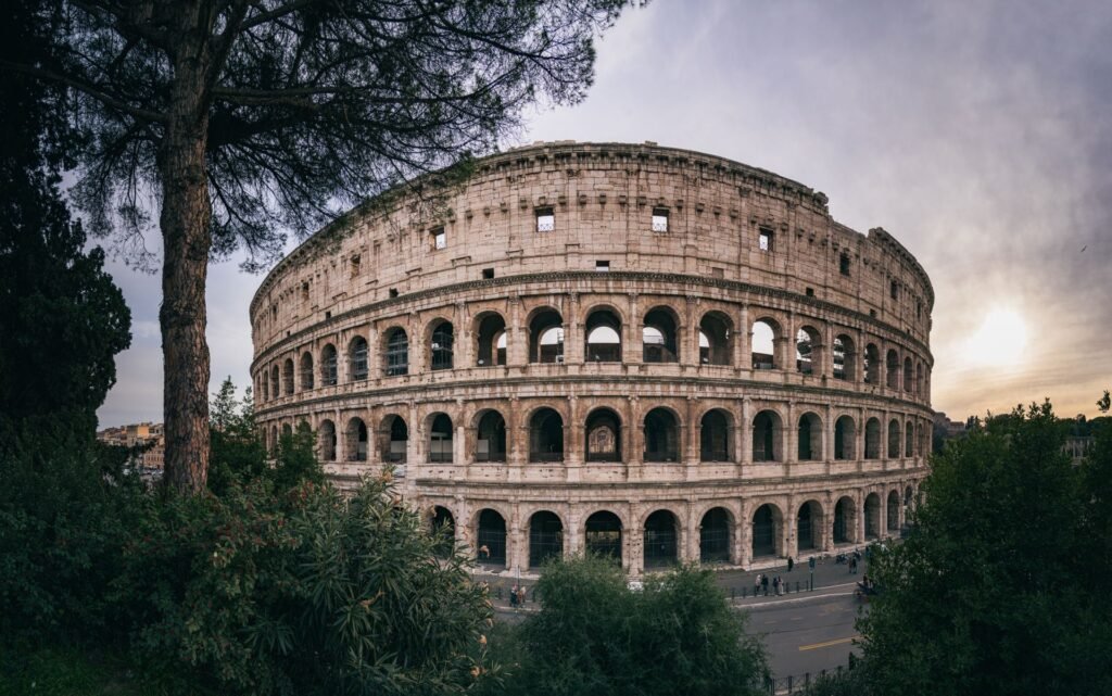 The Colosseum in Rome at sunset — removals to Italy from Surrey and London